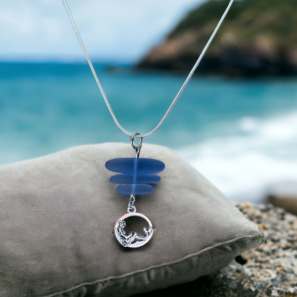 Sea glass and mermaid silver plated pendant. 
Artisan made.